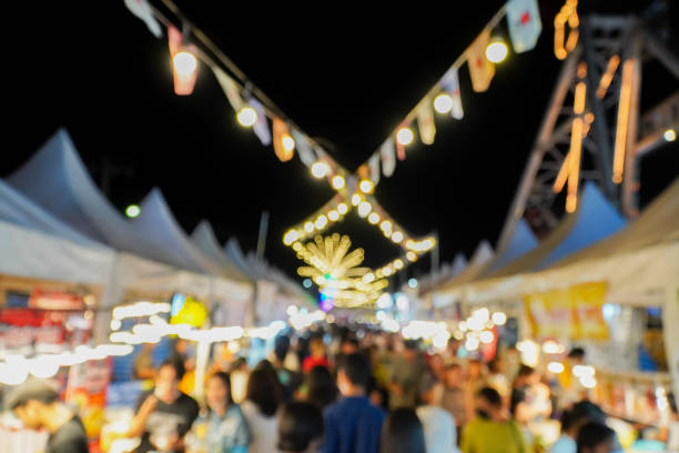 istock Blurred image of night market with people background, bokeh.(vintage sound) 1729486438