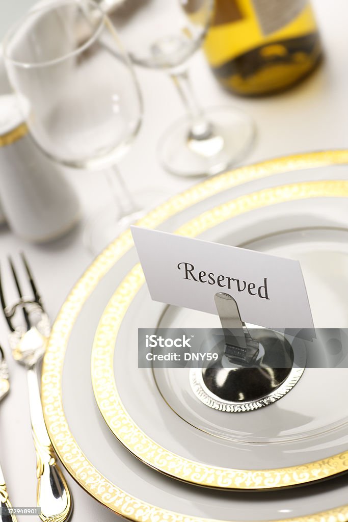 Table Reserved Reserved seat at a formal diiner Celebration Stock Photo