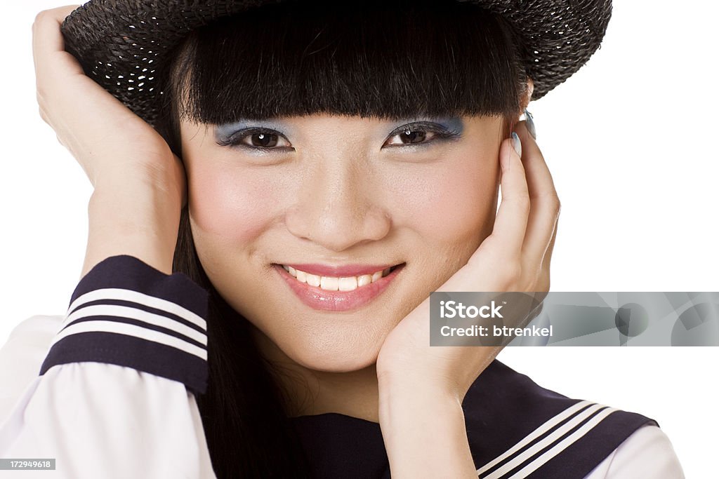 Fashionable Japanese student Cool fashion. Pepped up school uniform with hat Adult Stock Photo