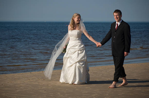 istock Wedding couple walking at the beach 172950233