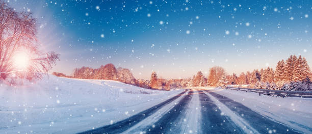 istock Beautiful winter road in natural sunny park. 1729504152