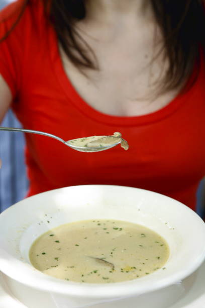 istock Woman Eating Soup 172950447
