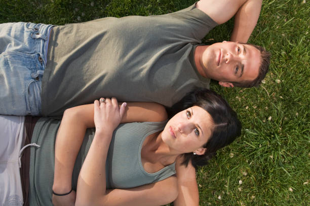 istock Happy Couple lying in grass dreaming 172950580