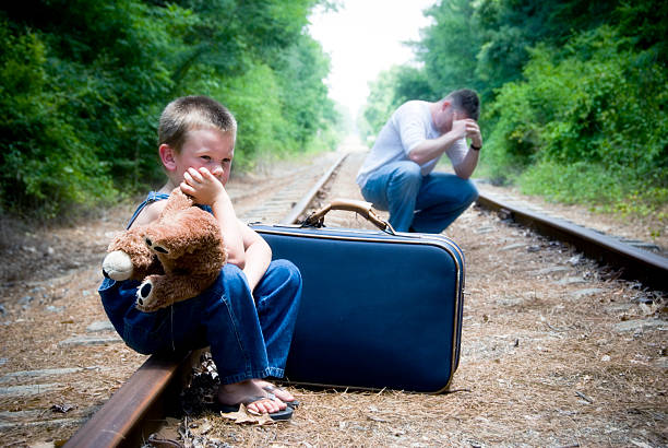 Desperate man and child on train tracks