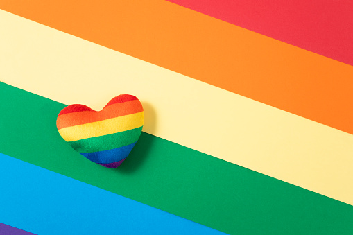 Rainbow cushion heart on rainbow colored background