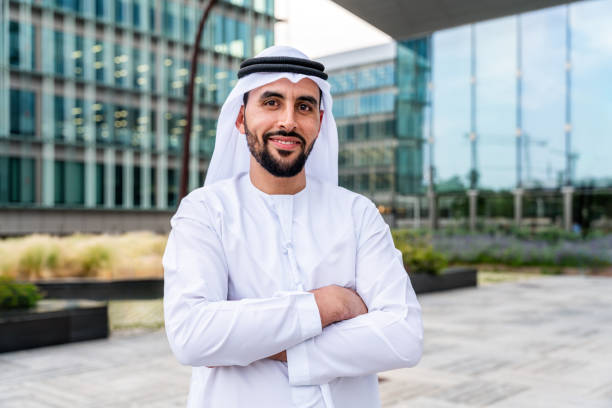Arab middle-eastern man wearing emirati kandora traditional clothing in the city stock photo