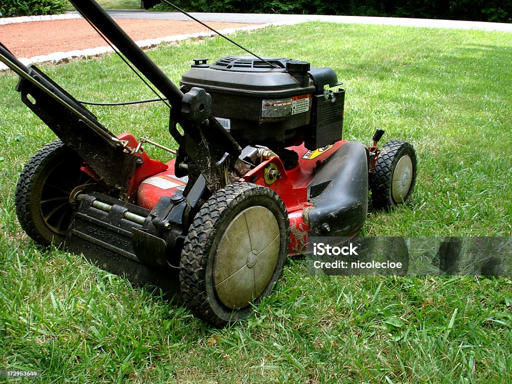 Mowing the Lawn The front lawn of a house being mowed. Also in this series: Mowing Stock Photo