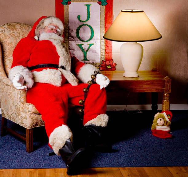 istock Santa rests in living room chair 172953896