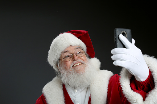 Santa Clause using cell phone