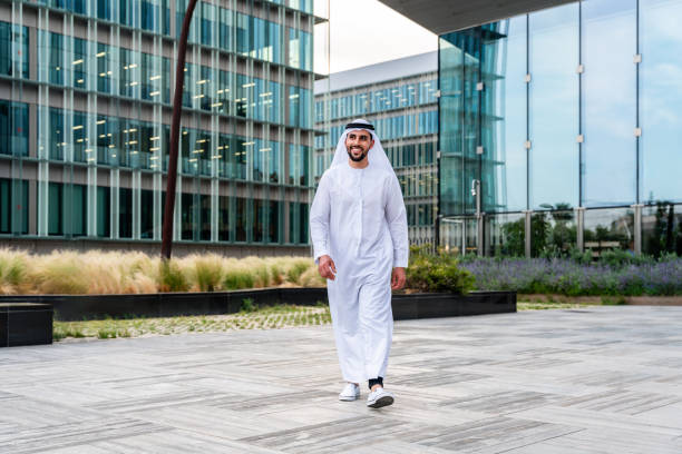 Arab middle-eastern man wearing emirati kandora traditional clothing in the city stock photo