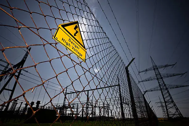 Photo of Chain link fence with a sign warning of high voltage