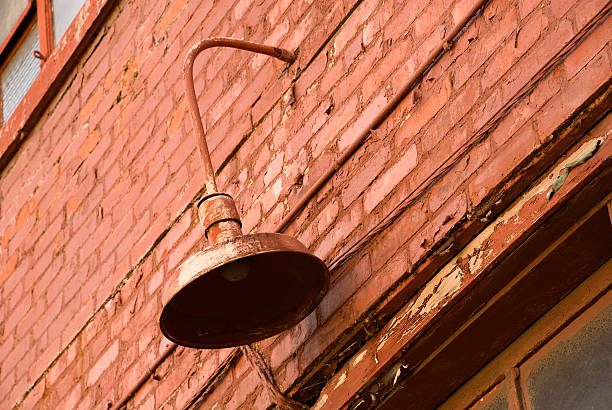 istock old lamp against weathered brick wall 172954692