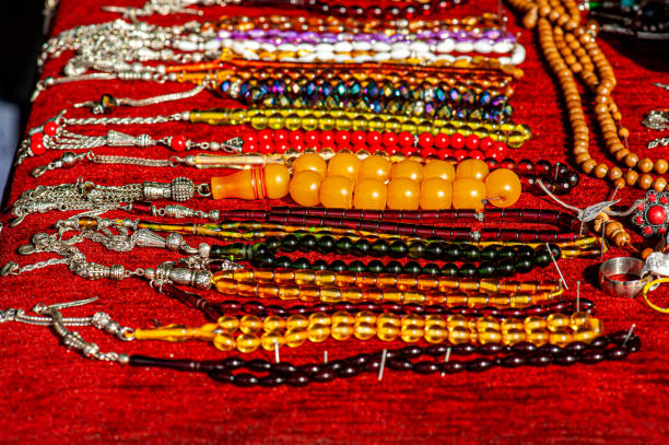 colorful prayer beads arranged in rows - antique old fashioned close up color image imagens e fotografias de stock