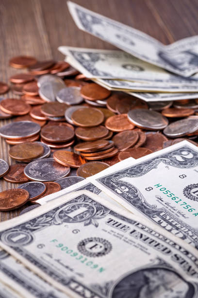 istock American coins and US dollars on a wooden table 1729549079
