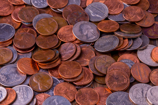 istock American coins and US dollars on a wooden table 1729549107