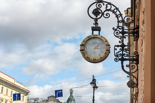 Russia, Saint Petersburg, September 2023: wall street clock on the wall of the building on Nevsky Prospekt