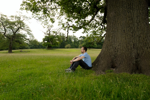 Man sitting under a tree