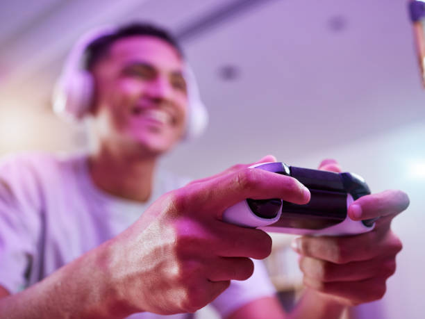 Headphones, controller and man on esport video game online and happy virtual challenge and excited in living room home. Internet, user experience and person, influencer or gamer streaming games Headphones, controller and man on esport video game online and happy virtual challenge and excited in living room home. Internet, user experience and person, influencer or gamer streaming games 4k gaming stock pictures, royalty-free photos & images