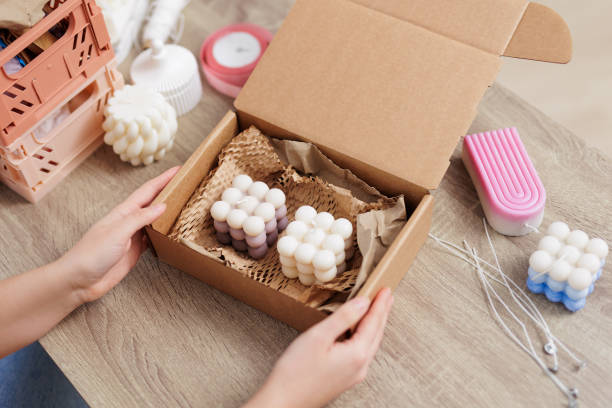 istock close up of female hands packaging handmade candles 1729566147