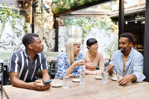 istock Multiracial people drinking coffee and bonding at the cafe 1729566158