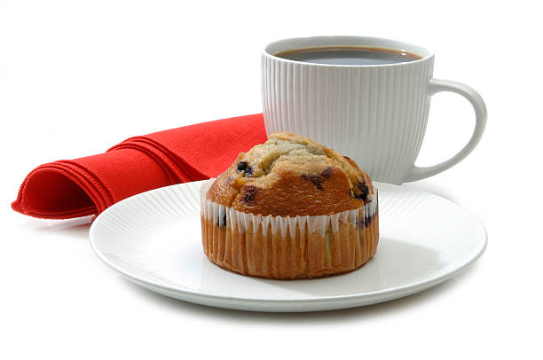 Coffee and Muffin Coffee and Muffin on White. continental breakfast stock pictures, royalty-free photos & images