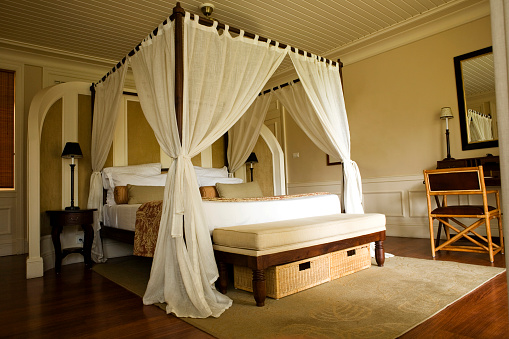 Four poster bed in a tropical resort.