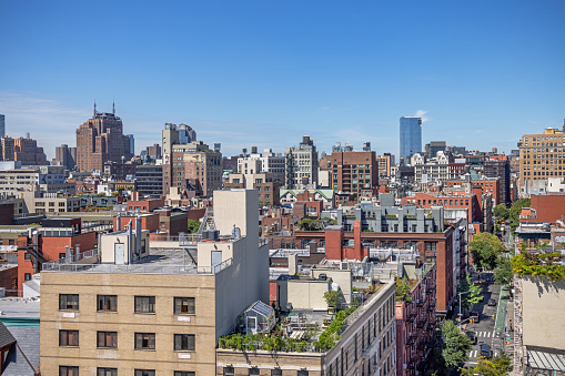 The Bowery, Manhattan, New York, USA - August 23th 2023: View over the many new roof gardens in Lower Manhattan from a high building on a clear summer day with blue sky