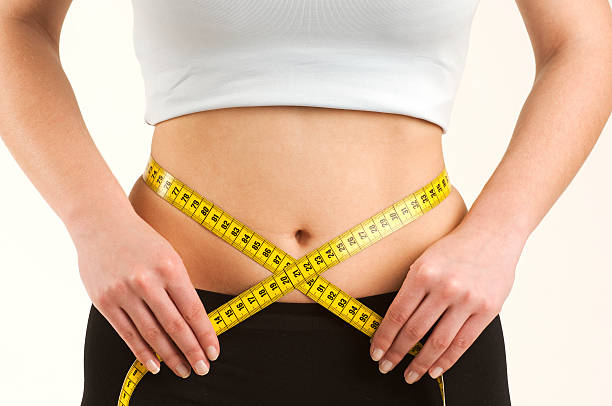 istock Woman measuring her waist 172956949