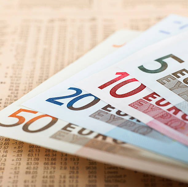 istock Euro banknotes on financial newspaper 172956957