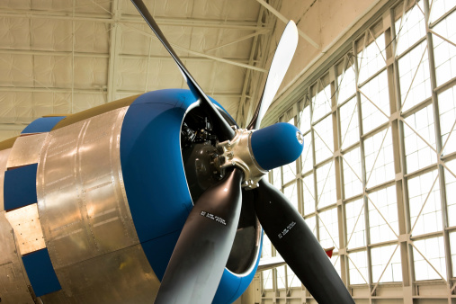 The nose and propeller of the mighty P-47 Thunderbolt basking in the morning light in a hangar.Please visit my lightbox for more similar photos