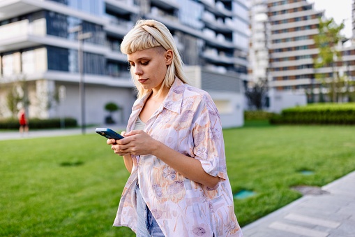 Close-up picture of a modern woman using her smartphone