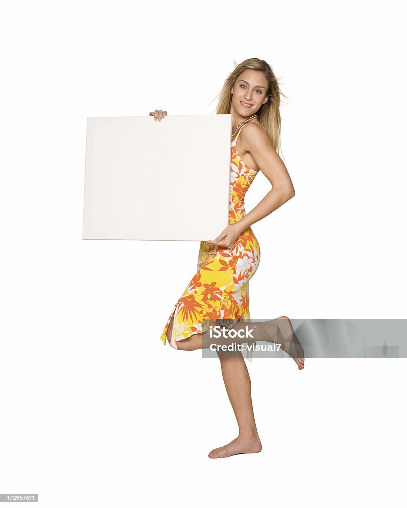 summer dress, billboard girl Beautiful, elegant blond summer girl, holding a blank paper, billboard ready, for sign advertising Billboard Stock Photo