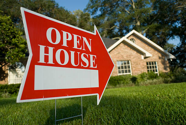 Red Open House sign pointing at house for inspection Open House sign with arrow and white space. model home photos stock pictures, royalty-free photos & images