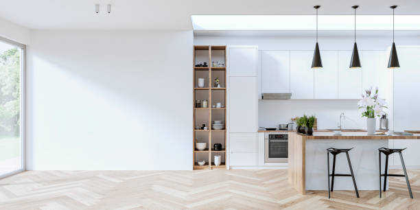 Modern white kitchen with rectangular breakfast kitchen island with stools, empty large white wall in front of a window Modern white and hardwood kitchen with stools in front of a rectangular breakfast kitchen island with spices, coffee cups, and a vase of lilies, on the hardwood herringbone floor. Four pendant black lights, kitchen hood, utensils, dishes, plates, and stoves on wall hardwood shelves and in open hardwood kitchen cabinets on one side. An empty large white wall in front of large windows on the side, a nice view of a luxurious garden in the background, and a large ceiling window over the whole kitchen. 3D rendered image. stove stock pictures, royalty-free photos & images