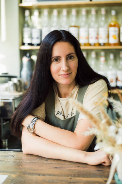 istock happy woman barista posing at workplace 1729585053