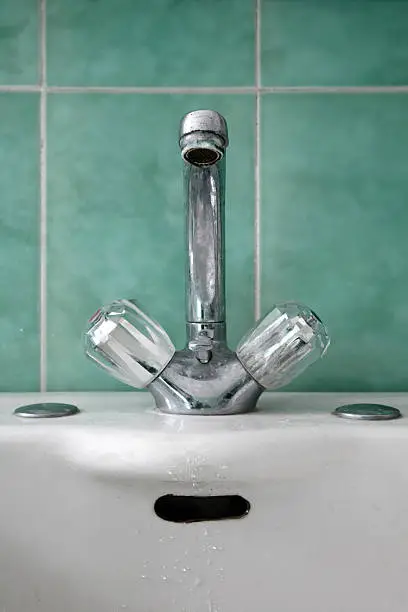Old faucet in retro bathroom.Classical and very stylish.