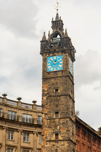 Historical clock tower at Street of glasgow scotland england UK