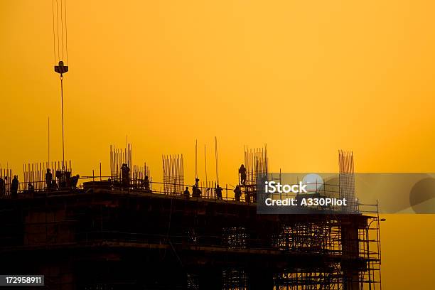 Sunset Construction Stock Photo - Download Image Now - Construction Site, In Silhouette, Sunset