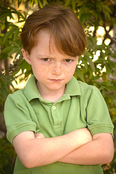 istock Angry & Unhappy Boy, Redhead Freckle Face Child with Sullen Expression 172959549