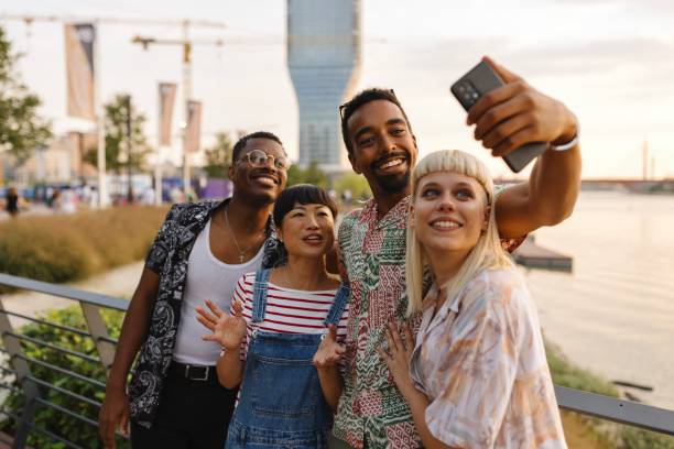 istock Beautiful people taking a selfie next to the river 1729601875
