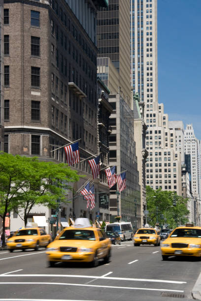 istock 5th Avenue with moving Yellow Cabs in Manhattan NYC 172960881