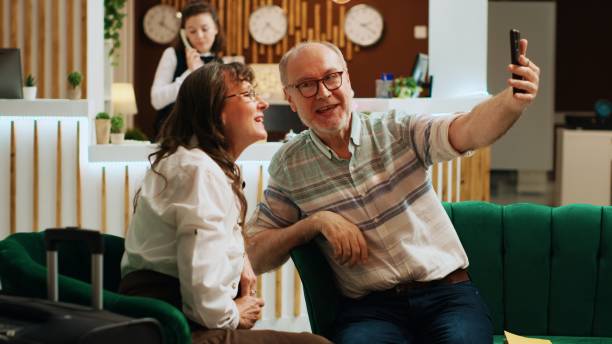 istock Old couple talk on videocall with kids 1729608927