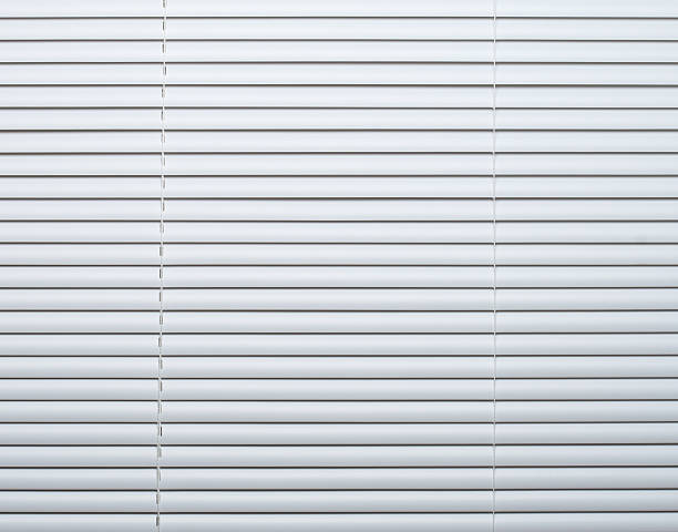 istock Panel of white window blinds in closed position 172961325