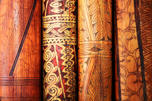 Close-up of handcrafted antique bamboo flutes with tribal art of Borneo. Click for more living art images: