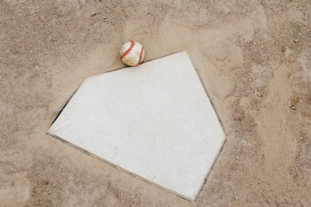 istock Used baseball next to home plate 172961413