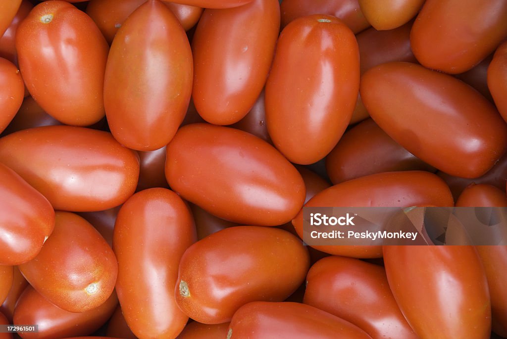 Roma Tomato Stack Background in Farmers Market Full frame bright red basket of shiny fresh Roma tomatoes Agricultural Fair Stock Photo