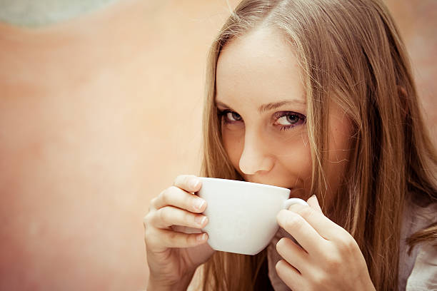 istock coquettish girl drinking coffee 172961592