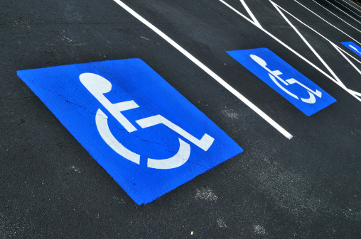 handicapped or disabled parking space traffic sign with wheelchair pictogram