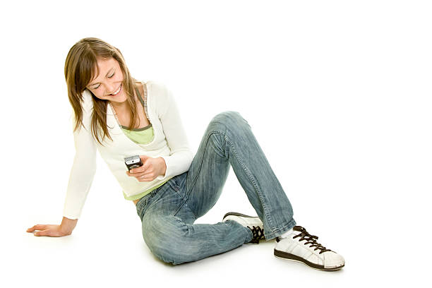 Attractive girl with telephone isolated on white stock photo