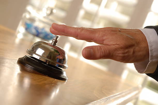 istock Hand touching a service bell on a countertop 172961955